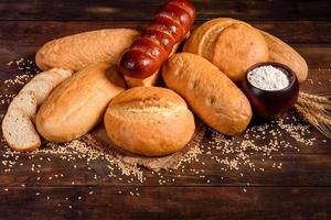 Fresh baked white bread on a brown concrete background photo