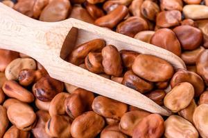 Beautiful multicolored beans close-up on a concrete background photo