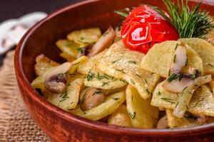 Rustic potato wedges with cheese, herbs and tomato sauce