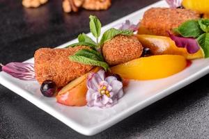 Fresh scented cheese sticks with baked apple and peach photo
