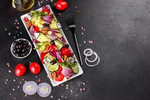 Healthy salad with cherry tomatoes, organic olives photo