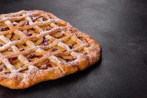 Delicious fresh pie baked with apple, pears and berries photo