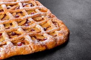 Delicious fresh pie baked with apple, pears and berries photo