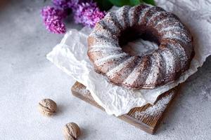 Round chocolate coffee cupcake with raisins and poppy photo