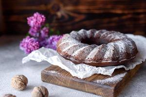 Round chocolate coffee cupcake with raisins and poppy photo