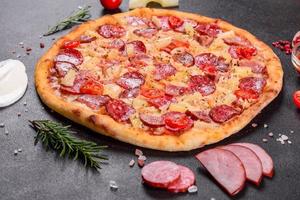 Pepperoni Pizza with Mozzarella cheese, salami, ham photo