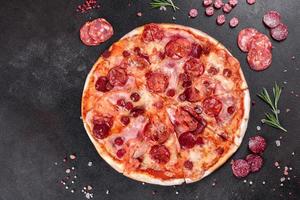 Pepperoni pizza with mozzarella cheese photo