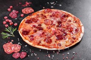 Pepperoni pizza with mozzarella cheese photo