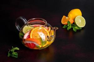 Hot fruit tea with lemon, mint, orange, lime and grapefruit