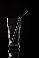 Empty glass silhouette isolated on dark background