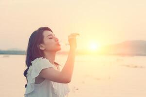 Young woman drinking water looking so fresh photo