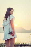 Vintage of women photography standing hand holding retro camera. photo