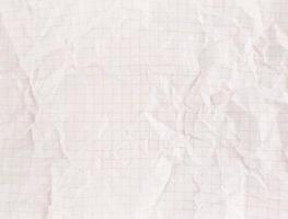 Crumpled white sectional paper sheet textured with empty space. photo