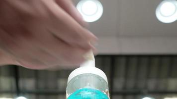 A Man Is Cleaning His Hands and Fingers with An Alcohol Gel video