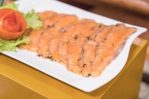 Smoked salmon on white plate photo