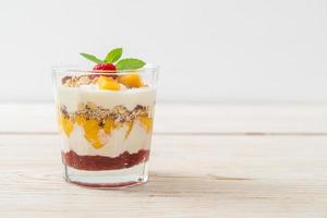 Homemade fresh mango and fresh raspberry with yogurt and granola - healthy food style photo