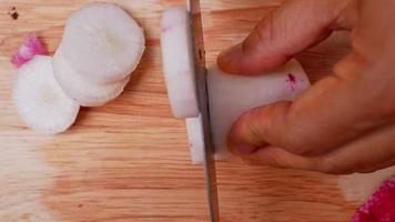 Close-Up of Woman Slicing a Red Radish video