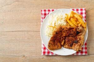 Grilled spicy barbecue kurobuta pork steak with french fries photo