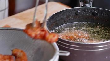 Woman in Gloves Are Frying the Marinated Chicken video