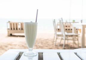 Vanilla milkshake smoothie in cafe photo