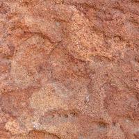 Red rough stone texture background. photo