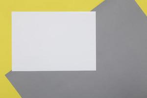 Blank Flyer paper on yellow half grey background photo