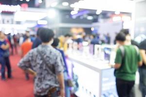 Abstract blur people in exhibition hall event trade show expo photo