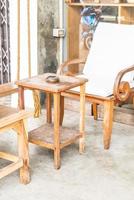 Outdoor patio with empty chair and table photo