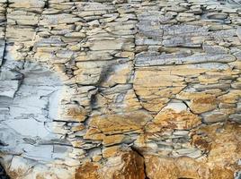 Mountain rock with grey, white, brown stones, Caucasus photo