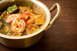 Sour soup made of Tamarind Paste with Shrimps and Vegetable Omelet photo