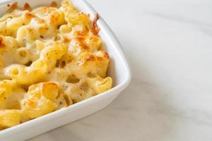 American mac and cheese, macaroni pasta in cheesy sauce photo