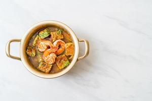 Sour soup made of Tamarind Paste with Shrimps and Vegetable Omelet photo