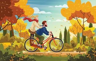 Pareja montando bicicleta en el concepto de parque de otoño
