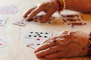 Guessing cards reading, grandma magic, fortune telling, women hands photo