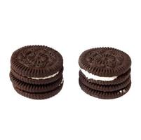 Tasty chocolate cookies with cream on white background photo