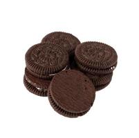 Tasty chocolate cookies with cream on white background photo