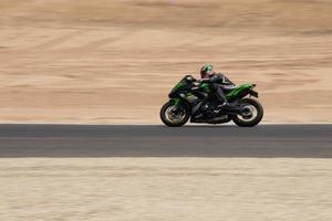 Motorcycle competition at a race track on a training day photo