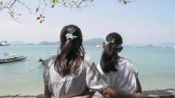 Mother Hugs Her Daughter Watching the Beautiful Scenery of The Pier video