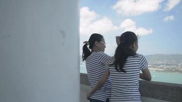 Mom and Daughter Hug Each Other Happily on View Point Tower