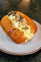 Bun or bread with scrambled eggs and truffle mushroom photo