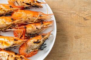 Grilled river prawns or shrimps - seafood style photo