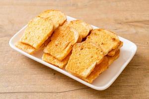 baked crispy bread with butter and sugar photo