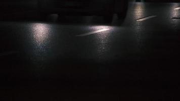 Reflection of car headlights on the road at night. video