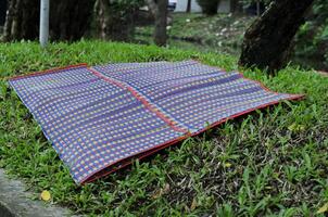 Traditional thai mat living on the garden backgrounds photo