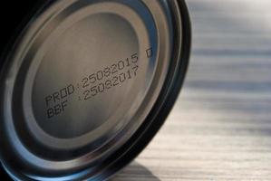 Expire date printed on bottom of canned food photo