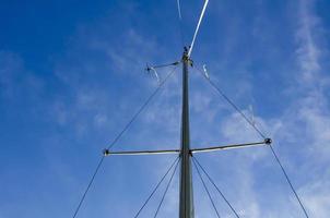 The mast of a yacht without sails. photo
