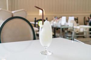 Fresh lemon-lime smoothie glass in cafe and restaurant photo