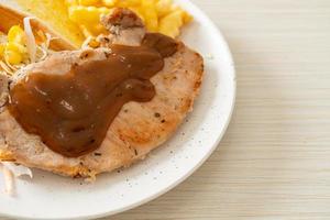 Pork steak with black peppers gravy sauce and mini salad photo