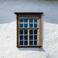 Old wooden window of the house. White photo