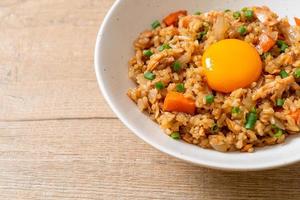 Salmon fried rice with pickled egg on top - Asian food style photo